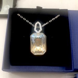 Swarovski golden crystal on one side and pave crystals on the other side